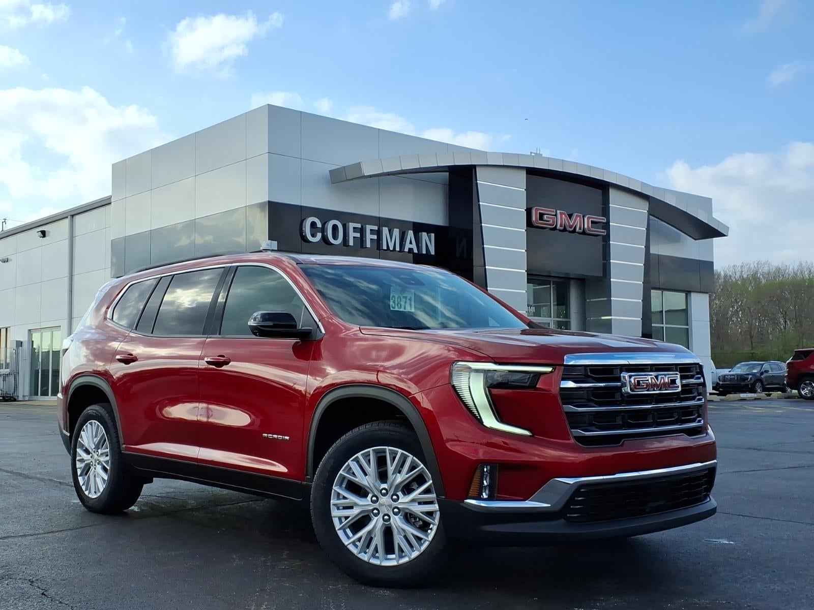 2026 GMC Acadia Elevation in Volcanic Red Tintcoat — front three-quarter view