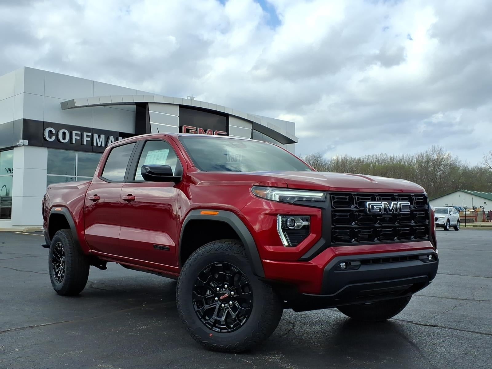 2026 GMC Canyon Elevation in Volcanic Red Tintcoat — front three-quarter view