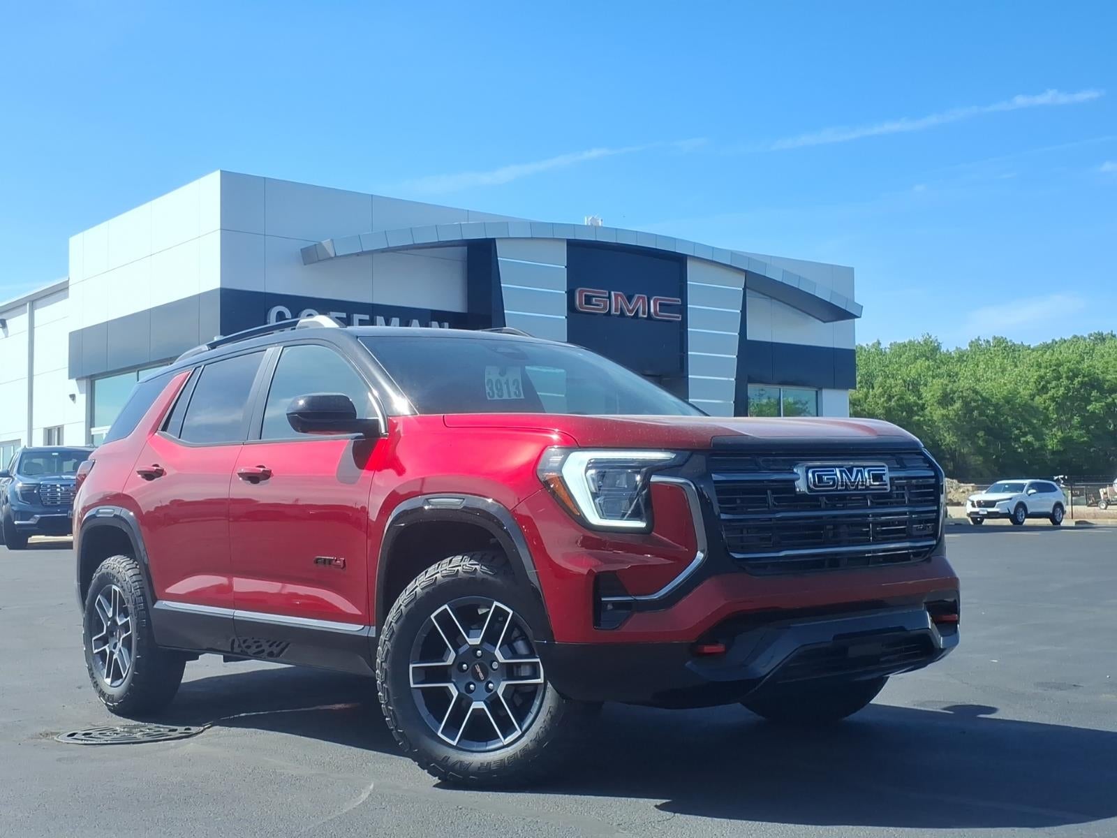 2026 GMC Terrain AT4 in Volcanic Red Tintcoat — front three-quarter view