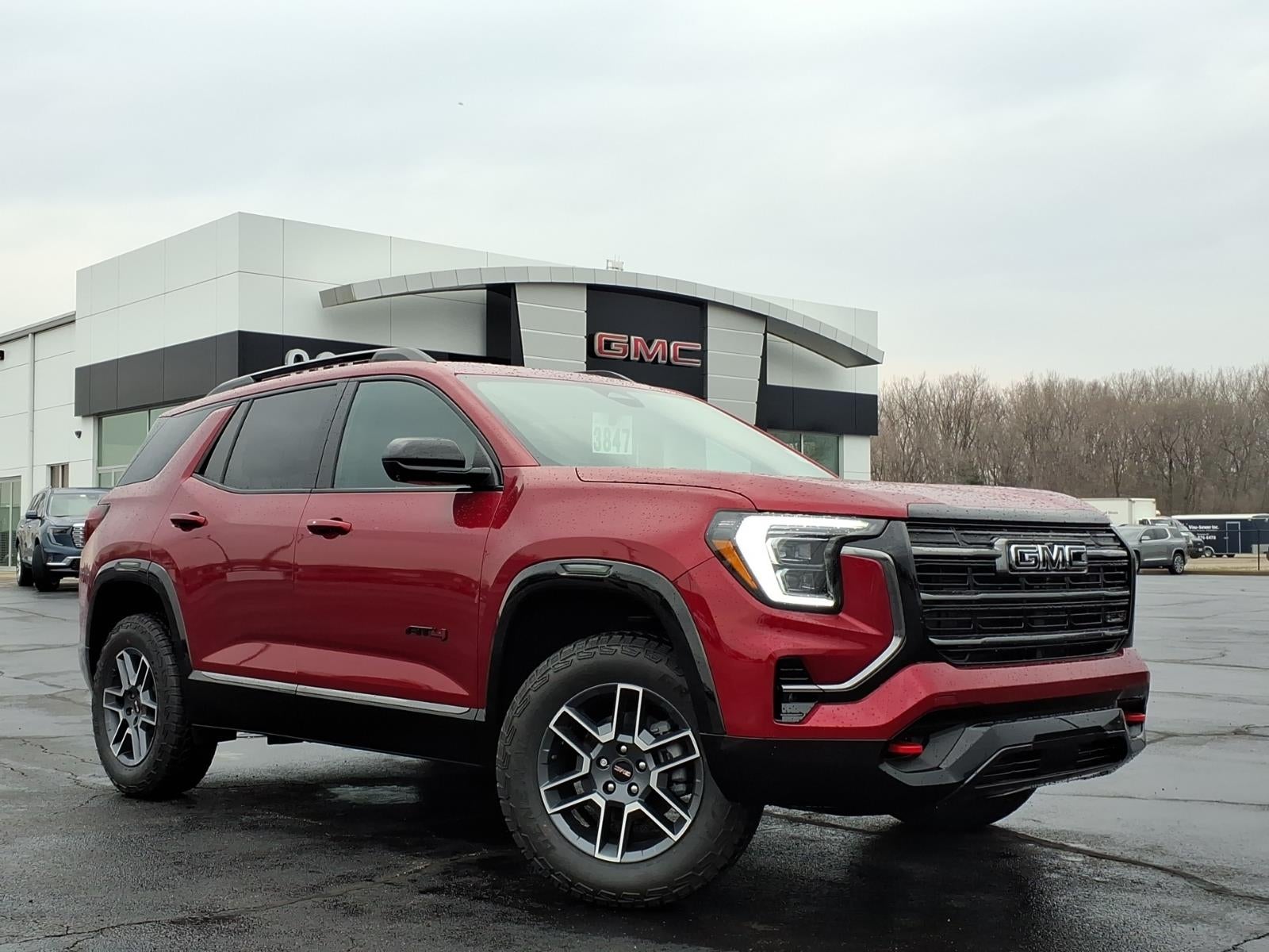 2026 GMC Terrain AT4 in Volcanic Red Tintcoat — front three-quarter view