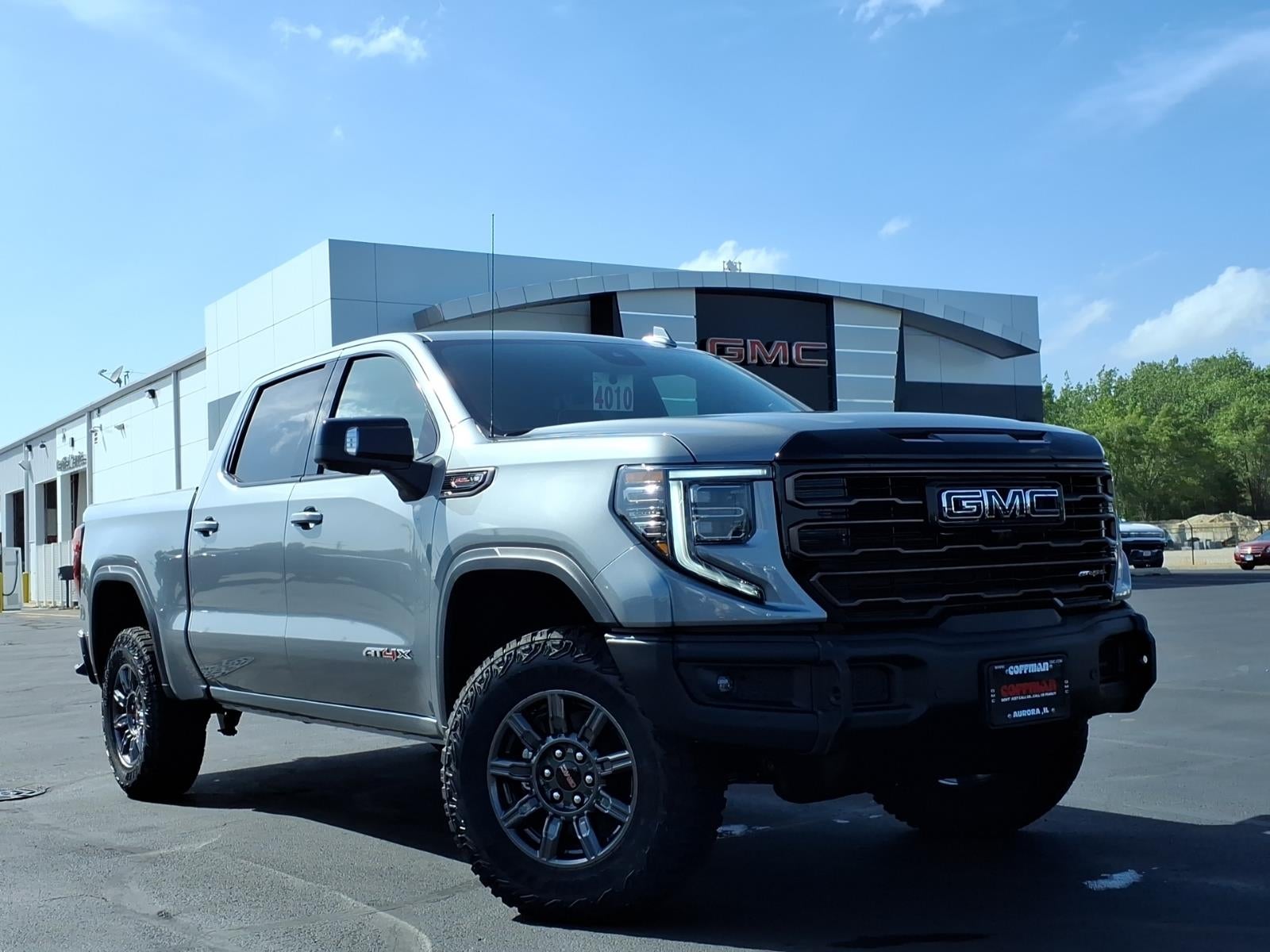 2026 GMC Sierra 1500 AT4X in Sterling Metallic — front three-quarter view